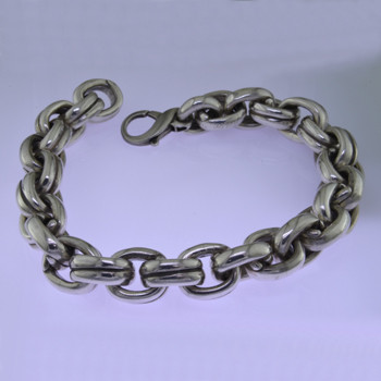 Go bold with this stylish oval link Sterling Silver bracelet, in a modern design. Uniquely designed for a man, it effortlessly transitions from casual to dressy. Weighs a hefty 3 1/2 ounces. and measures about 1/2 inch wide and 8 1/2 inches long.

by David Heston of San Rafael, California.