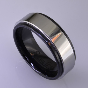 For the innovative and unique man, this men's ring can be for many occasions. Wear it as a wedding ring, or just a stylish everyday fashion statement ring. This ring is ultra durable for the guy who plays rough. And no charge for re-sizing. This ring is 8mm wide in black ceramic, with a 6mm polished cobalt chrome overlay, polished to a silky smooth finish. Ring shown is a size 10, but call us with your finger size and we will make it just for you. Usually within just a few days.

This ring is hypoallergenic, and environmentally friendly. Made with Gem Ceramique, this ring uses high tech zirconia ceramic, virtually as hard as sapphire. Ultra durable and stylish, versatile and unique. It even has a Lifetime "Peace of mind" warranty against breakage.

Created by award winning jewelry artist Etienne Perret, and made in his studio in Camden, Maine.

This ring is hypoallergenic, and environmentally friendly. Made with Gem Ceramique, this ring uses high tech zirconia ceramic, virtually as hard as sapphire. Ultra durable and stylish, versatile and unique. It even has a Lifetime "Peace of mind" warranty against breakage.

Created by award winning jewelry artist Etienne Perret, and made in his studio in Camden, Maine.