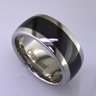 For the innovative and unique man, this men's ring can be for many occasions. Wear it as a wedding ring, or just a stylish everyday fashion statement ring. This ring is ultra durable for the guy who plays rough. And no charge for re-sizing. This ring is 10mm wide with a slight dome, in polished cobalt chrome, with a 5mm black ceramic inlay, polished to a silky smooth finish. Ring shown is a size 10.5, but call us with your finger size and we will make it just for you. Usually within just a few days.

This ring is hypoallergenic, and environmentally friendly. Made with Gem Ceramique, this ring uses high tech zirconia ceramic, virtually as hard as sapphire. Ultra durable and stylish, versatile and unique. It even has a Lifetime "Peace of mind" warranty against breakage.

Created by award winning jewelry artist Etienne Perret, and made in his studio in Camden, Maine.