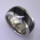 For the innovative and unique man, this men's ring can be for many occasions. Wear it as a wedding ring, or just a stylish everyday fashion statement ring. This ring is ultra durable for the guy who plays rough. And no charge for re-sizing. This ring is 10mm wide with a slight dome, in polished cobalt chrome, with a 5mm black ceramic inlay, polished to a silky smooth finish. Ring shown is a size 10.5, but call us with your finger size and we will make it just for you. Usually within just a few days.

This ring is hypoallergenic, and environmentally friendly. Made with Gem Ceramique, this ring uses high tech zirconia ceramic, virtually as hard as sapphire. Ultra durable and stylish, versatile and unique. It even has a Lifetime "Peace of mind" warranty against breakage.

Created by award winning jewelry artist Etienne Perret, and made in his studio in Camden, Maine.