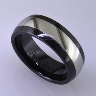 For the innovative and unique man, this men's ring can be for many occasions. Wear it as a wedding ring, or just a stylish everyday fashion statement ring. This ring is ultra durable for the guy who plays rough. And no charge for re-sizing. This ring is 8mm wide with a slight dome, in polished black ceramic, with a 4mm cobalt chrome inlay, polished to a silky smooth finish. Ring shown is a size 10, but call us with your finger size and we will make it just for you. Usually within just a few days.

This ring is hypoallergenic, and environmentally friendly. Made with Gem Ceramique, this ring uses high tech zirconia ceramic, virtually as hard as sapphire. Ultra durable and stylish, versatile and unique. It even has a Lifetime "Peace of mind" warranty against breakage.

Created by award winning jewelry artist Etienne Perret, and made in his studio in Camden, Maine.

This ring is hypoallergenic, and environmentally friendly. Made with Gem Ceramique, this ring uses high tech zirconia ceramic, virtually as hard as sapphire. Ultra durable and stylish, versatile and unique. It even has a Lifetime "Peace of mind" warranty against breakage.

Created by award winning jewelry artist Etienne Perret, and made in his studio in Camden, Maine.