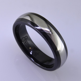 For the innovative and unique man, this men's ring can be for many occasions. Wear it as a wedding ring, or just a stylish everyday fashion statement ring. This ring is ultra durable for the guy who plays rough. And no charge for re-sizing. This ring is 6mm wide with a slight dome, in polished black ceramic, with a 3mm cobalt chrome inlay, polished to a silky smooth finish. Ring shown is a size 10, but call us with your finger size and we will make it just for you. Usually within just a few days.

This ring is hypoallergenic, and environmentally friendly. Made with Gem Ceramique, this ring uses high tech zirconia ceramic, virtually as hard as sapphire. Ultra durable and stylish, versatile and unique. It even has a Lifetime "Peace of mind" warranty against breakage.

Created by award winning jewelry artist Etienne Perret, and made in his studio in Camden, Maine.

This ring is hypoallergenic, and environmentally friendly. Made with Gem Ceramique, this ring uses high tech zirconia ceramic, virtually as hard as sapphire. Ultra durable and stylish, versatile and unique. It even has a Lifetime "Peace of mind" warranty against breakage.

Created by award winning jewelry artist Etienne Perret, and made in his studio in Camden, Maine.