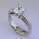 This beautiful diamond engagement ring design with its simple, clean lines frames your diamond perfectly. The bottom has soft rounded corners for the ultimate comfort. This is a contemporary, but timeless design.
This elegant diamond engagement ring is priced in 14k white gold, and can be made in any karat or color of gold, and in platinum. Set with .17ct. of ideal cut diamonds, this one is shown with a 1 carat princess cut center (sold seperately), but we will make it for any size. A matching shadow wedding ring or a diamond wedding ring is available.
This custom designed engagement ring is individually crafted to be Perfectly You, and takes about 2 weeks to create. Call us for more information about how we can customize this design Just For You. Designed, and created in our studio by the artist Stuart J. This beautiful diamond engagement ring design with its simple, clean lines frames your diamond perfectly. The bottom has soft rounded corners for the ultimate comfort. This is a contemporary, but timeless design.
This elegant diamond engagement ring is priced in 14k white gold, and can be made in any karat or color of gold, and in platinum. Set with .17ct. of ideal cut diamonds, this one is shown with a 1 carat princess cut center (sold seperately), but we will make it for any size. A matching shadow wedding ring or a diamond wedding ring is available.
This custom designed engagement ring is individually crafted to be Perfectly You, and takes about 2 weeks to create. Call us for more information about how we can customize this design Just For You. Designed, and created in our studio by the artist Stuart J.
