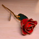 Real semi-opened rose, with petals dipped in rich red lacquer and trimmed in 24kt gold. Stem is approximately 12" long and is heavy gold plated. Each rose is elegantly wrapped in gold tissue and packaged in a gold, two-piece outer box. Price includes the vase, and regular shipping.
