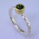 This cool, hip, and fun stackable ring is the start of your new collection. This ring will have many different looks when you stack it with other rings, or enjoy it alone in your everyday style. Hand finished in Sterling sliver with an 18 karat yellow gold bezel holding a beautiful 4.5mm round green tourmaline. Finger size 7. We will make this in any size you need in about ten days.
Designed, and created in our studio by the artist Stuart J.

This ring is also shown in other gemstone colors and sizes, which are sold separately, and can be stacked with all other rings in our stackables collection. You can also stack it with any ring you like. There are no rules. Call us with your favorite color, and we will customize this Just For You.