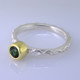 This cool, hip, and fun stackable ring is the start of your new collection. This ring will have many different looks when you stack it with other rings, or enjoy it alone in your everyday style. Hand finished in Sterling sliver with an 18 karat yellow gold bezel holding a beautiful 4.5mm round green tourmaline. Finger size 7. We will make this in any size you need in about ten days.
Designed, and created in our studio by the artist Stuart J.

This ring is also shown in other gemstone colors and sizes, which are sold separately, and can be stacked with all other rings in our stackables collection. You can also stack it with any ring you like. There are no rules. Call us with your favorite color, and we will customize this Just For You.