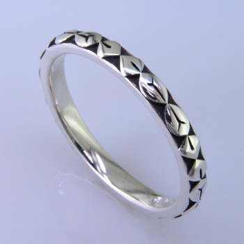 This cool, hip, and fun stackable ring is the start of your new collection. This ring will have many different looks when you stack it with other rings, or enjoy it alone in your everyday style. Hand finished in Sterling sliver with a beautiful leaf design. Finger size 7. We will make this any size you need in about 10 days. Band measures 2.5mm wide. 

Designed, and created in our studio by the artist Stuart J.

This ring is also shown with other gemstone colors and sizes, which are sold separately, and can be stacked with all other rings in our stackables collection. You can also stack it with any ring you like. There are no rules. Call us with your favorite color, and we will customize this Just For You.