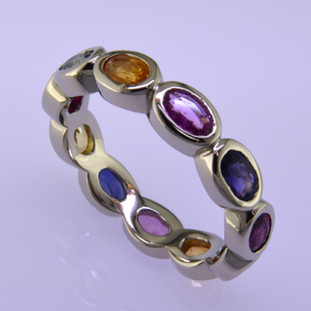 Color ring 193- Beautiful rainbow colored oval sapphire anniversary ring.