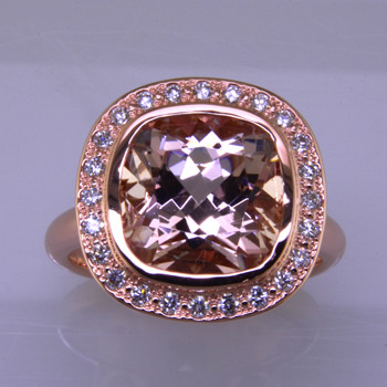 Wed 320a- Who says you need a diamond for your halo engagement ring.  This custom designed halo engagement ring is beyond gorgeous.  Made in 14 karat rose gold surrounded by ideal cut diamonds, and in the center, this beautiful dusty peachy pink morganite.  Spectacular!