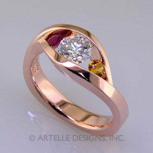 Wed 325-  Custom designed 14 karat rose gold diamond engagement ring. This ring is sleek and modern with no prongs.  Make it even more custom by using the gemstones ruby and citrine to signify when you met, and your birthday.  How much more custom can this get?