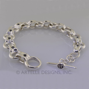 For a graduation, or special occasion this is the perfect gift. Custom Designed sterling silver link bracelet with round black diamonds accenting every other link. You will definitely feel this on your wrist.
