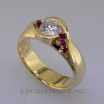  Ladies custom designed yellow gold diamond and ruby engagement ring.  Sprinkled with small rubies, and a bezel set diamond center.