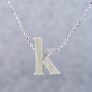 What's your story? Begin with this Little "K" initial solid Sterling Silver pendant. Wear it alone, with other pendants, or layered with other necklaces. Comes with a sterling silver ball chain, 16 inches long. The pendant measures 1/4 inch long. Too cute!

Signified by a feminine sensibility and optimistic charm, Alex Woo's Little Icon Collections reinvent familiar symbols from the world around us into fresh and expressive designs.

Designed and handcrafted in our studio.