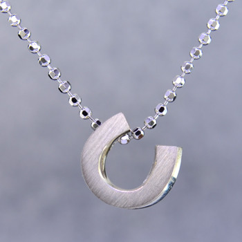 What's your story? Begin with this Little lucky horseshoe solid Sterling Silver pendant. Wear it alone, with other pendants , or layered with other necklaces. Comes with a sterling silver ball chain, 16 inches long. The pendant measures 1/4 inch long. Too cute!

Signified by a feminine sensibility and optimistic charm, Alex Woo's Little Icon Collections reinvent familiar symbols from the world around us into fresh and expressive designs.

Designed and handcrafted by Alex Woo in New York City.