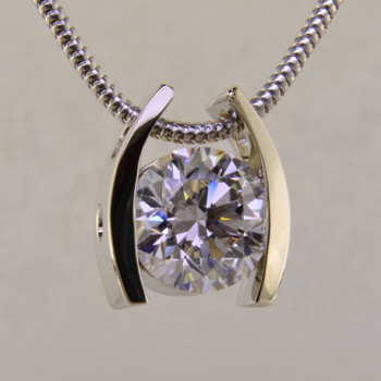 Ladies white gold custom designed solitare pendant.