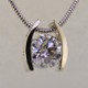 Ladies white gold custom designed solitare pendant.