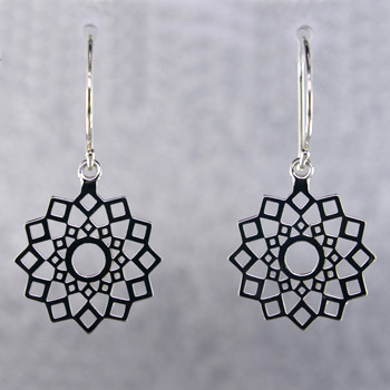Designed, and created in our studio by the artist Stuart J., these airy earrings are fun for day or night. Handcrafted in Sterling Silver, hanging on wires. They measure 1 1/4 inches long.

More metal options are available. Please call us to find out the other options.