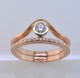Sleek and modern rose gold diamond wedding ring to match our Katie Rose, or to wear seperately as an eternity or stackable ring. This diamond ring has 32 sparkling ideal cut diamonds weighing .16ct. Made in a size 6 3/4. Call for other sizes, or other gold options.

Made in our studio by the artist Stuart J.
