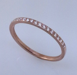 This matching diamond wedding ring to Adelina is an elegant compliment to an already classy engagement ring design.  Lined with .10ct. total weight of brilliant cut diamonds, hand set in 18 karat Rose gold. You can also wear it as a stackable ring, or as is! 

Designed by the acclaimed artist Alishan in his California studio.