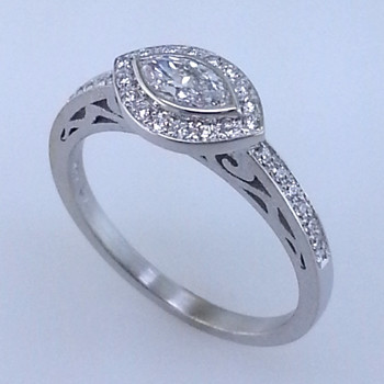 Using sophisticated techniques, this mesmerizing diamond engagement ring is designed to thrill and inspire. Hand crafted in 18 karat white gold, and set with .19ct. total weight of brilliant cut diamonds. A gorgeous .28ct. bezel set marquise diamond is the focal point of this elegant engagement ring. This design blends contemporary and classical, for an understated yet sophisticated look.

Designed by the acclaimed artist Alishan in his California studio. All designs can be made any way you like, with any gemstones you like.