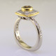 Here is a diamond halo engagement ring with a sophisticated flare. Custom designed with .45. T.W. of pavé set ideal cut diamonds makes this ring sparkle like crazy! A beautiful .57ct. round natural cognac color diamond is the focal point of this uniquely styled pavé halo diamond ring. It is set in an 18 karat yellow gold bezel to accentuate its vivid color, and also happens to make it look more like a one carat diamond! And not a single prong to worry about! This pavé diamond engagement ring feels smooth and is easy to wear. It is hand made in 14 karat white gold, with an 18 karat yellow gold border to beautifully frame the diamond halo. You will love the custom touches on this sweet engagement ring, like the beautiful open design on the underside. 
As with all of our designs, we will make this any way you like, with any gemstones you like.

Custom designed and hand crafted in our studio by the artist Stuart J.
