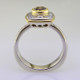 Here is a diamond halo engagement ring with a sophisticated flare. Custom designed with .45. T.W. of pavé set ideal cut diamonds makes this ring sparkle like crazy! A beautiful .57ct. round natural cognac color diamond is the focal point of this uniquely styled pavé halo diamond ring. It is set in an 18 karat yellow gold bezel to accentuate its vivid color, and also happens to make it look more like a one carat diamond! And not a single prong to worry about! This pavé diamond engagement ring feels smooth and is easy to wear. It is hand made in 14 karat white gold, with an 18 karat yellow gold border to beautifully frame the diamond halo. You will love the custom touches on this sweet engagement ring, like the beautiful open design on the underside. 
As with all of our designs, we will make this any way you like, with any gemstones you like.

Custom designed and hand crafted in our studio by the artist Stuart J.