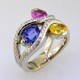 You will feel special with this very special gemstone ring on your finger. This unique, custom designed diamond and natural color sapphire ring has a display of color to rival nature! Yummy Blue, Yellow, and Pink oval, natural color sapphires, intertwined with .45 carat total weight of sparkling ideal cut diamonds. All meticulously set in 14 karat white gold. This diamond and sapphire gemstone ring will warm your heart, and make you smile every day! :) The finger size is 7, and can be sized up or down about 2 two sizes, plus or minus. 
This is a special, one of a kind piece.

Designed and created in our studio by the artist Stuart J.