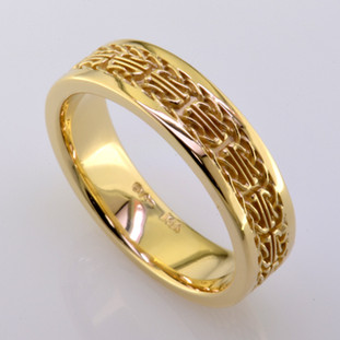 What is Irish, means faithful and loyal, and is a mans wedding band? Meet Dillon. This handsome ring is 6mm wide, is crafted in rich 14 karat yellow gold, and has an intricate celtic pattern. This wedding ring is a size 10.5, but can be made in any finger size, width, or metal you desire. Please allow 2- 3 weeks for us to make it Just For You.

Designed, and created in our studio by the artist Stuart J.