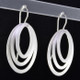 These earrings are sure to make you feel good. Edgy and modern ovals in Sterling Silver. Hanging silver wires, these earrings measure 1 1/2 inches long.  

Handcrafted in Istanbul.