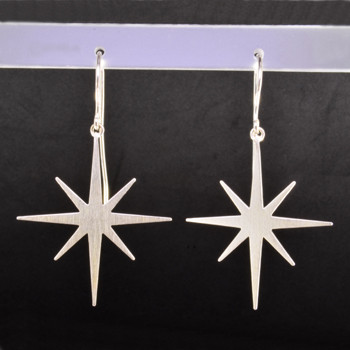 These earrings are not only beautiful, but the proceeds go to the Be the Light Charity. Sterling silver stars hanging on silver wires. Measures 1 3/4 inches long. Check out the website at www.urban-light.org.  Made in Istanbul.