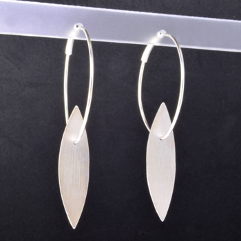 Fun, everyday open leaf hoop earrings, handmade in Sterling Silver, and a smooth matte finish. Measuring 2 inches long.  

Designed and handmade in Istanbul, Turkey.  
