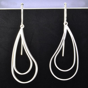  Fun open and modern sterling silver earrings with a paisley design. Hangs on sterling silver wires. Measures 2 inches long. Created in Istanbul.