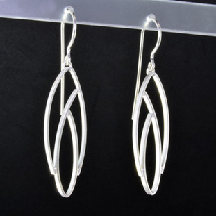  Light and breezy sterling silver modern open leaf earrings. Hangs on sterling silver wires, and measures 1 3/4 inches long. Created in Istanbul.