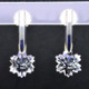 What's better than one sparkling snowflake? Two, of course. One for each ear. And you can turn up the heat, because these snowflakes won't melt. Exclusively ours, each colorless topaz snowflake is custom cut just for us, in Canada, by master gem cutters. Each snowflake measures 10mm, and dangles in a sterling silver Piercette® setting on a post, measuring 1 inch long.

Designed, and created in our studio by the artist Stuart J.

A Piercette® is a patented method of setting, with a gemstone that moves. The gem is set so that it swivels with every movement of the wearer, exhibiting extra sparkle.