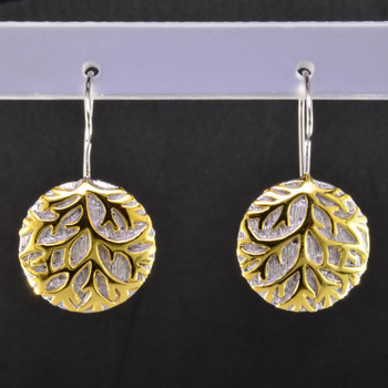 Gold branches stand out against a wintry white background in these nature inspired Sterling Silver earrings. Hanging on sterling silver wires. The earrings measure 1 inch long for a distinctive look. An Exceptional Value.

Handcrafted in Northern Spain.  