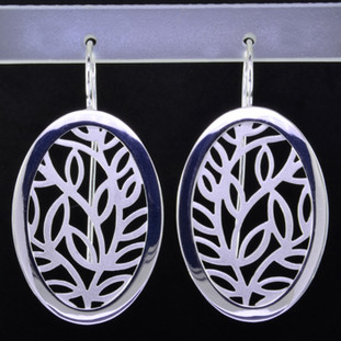  These oval open leaf motif design sterling silver earrings will make any outfit shine. Wear them with jeans or an evening out. With sterling silver ear wires. Measures 1 3/4 inches long. Handmade in Istanbul, Turkey.