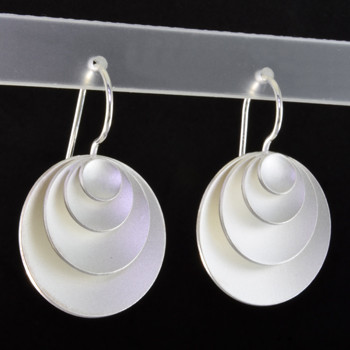 Fun, everyday four tier circle earrings, handmade in Sterling Silver, and a smooth matte finish. With sterling silver ear wires. Measuring 1 inch long.  
Designed and handmade in Istanbul, Turkey.  