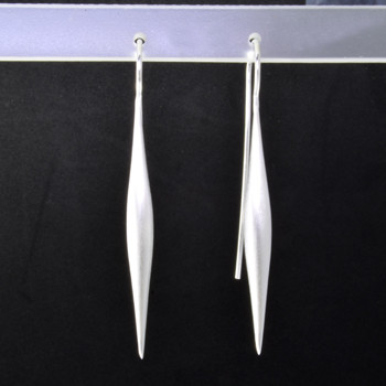  Beautiful sterling silver long drop icicle earrings, with a soft finish. Hangs on sterling silver wires.  Elegant, sophisticated, and one of a kind. Wear for day, or evening.Measures 2 inches long. Handmade in Istanbul, Turkey.