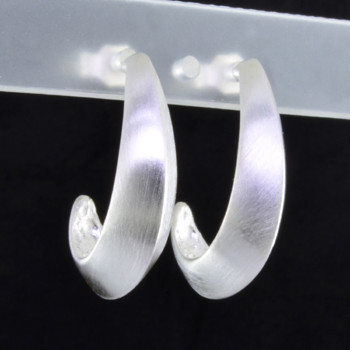 Try this traditional sterling silver half hoop earring with a modern touch. Fun shape and soft feel makes it unique. Earrings measure 1 inch long and hangs on sterling silver posts. Handmade in Istanbul, Turkey.