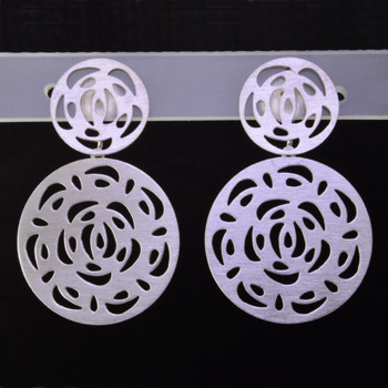 Playful and bright, these double circle open filagree dangle earrings are a delight to wear and they will make you smile. Crafted in Sterling Silver with a floral pattern, hanging on posts, and measuring 1 1/4 inches long. 

Handmade in Istanbul, Turkey.