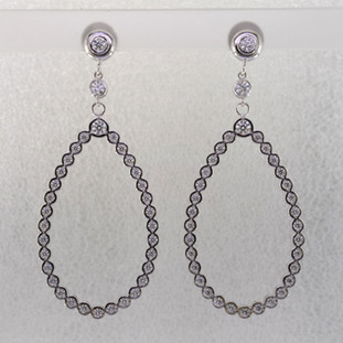 These jaw-dropping and elegant dangle diamond earrings will make you the envy of everyone that sees them. Crafted in 14 karat white gold, with 2.36 carats of sparkling ideal cut diamonds. Set in bezels so they feel soft and smooth, you will feel like a queen with these on your ears! Hangs on posts, and measures 2 1/4 inches long.

Made in our studio by the artist Stuart J.

These earrings can be customized to be Perfectly You, ans made in any karat or color of gold, and in platinum.