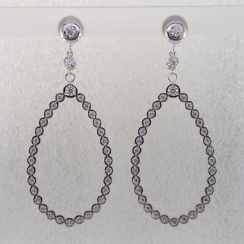 These jaw-dropping and elegant dangle diamond earrings will make you the envy of everyone that sees them. Crafted in 14 karat white gold, with 2.36 carats of sparkling ideal cut diamonds. Set in bezels so they feel soft and smooth, you will feel like a queen with these on your ears! Hangs on posts, and measures 2 1/4 inches long.

Made in our studio by the artist Stuart J.

These earrings can be customized to be Perfectly You, ans made in any karat or color of gold, and in platinum.