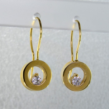 These floating diamond earrings are modern and timeless. Classic circles in 14 karat yellow Gold with .20ct. T.W. Ideal cut Diamonds, hanging on wires. Measure 3/4 inch long.

Designed, and created in our studio by the artist Stuart J.