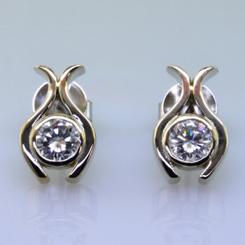 Sweet, simple, modern tulip diamond earrings. Wear them for work or play. Crafted in 14 karat Yellow Gold with .77ct. T.W. Ideal cut Diamonds, with posts. Measure 1/2 inch long.

Designed, and created in our studio by the artist Stuart J.