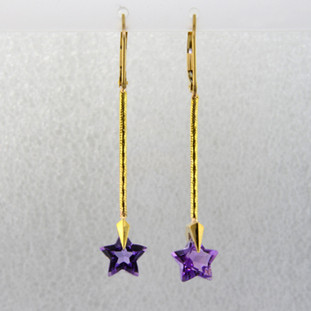 You can wish upon a star with these beautiful star earrings. Exclusively ours, each amethyst gemstone star is custom cut just for us, in Canada, by master gem cutters who know what stars look like. Each star measures 8mm, and dangles from the bottom of 14 karat yellow gold teardrop Piercette,and dangling from a thin gold snake chain wire. These gorgeous earrings measure 1 3/4 inch long, and have lever backs. They are available with Colorless Topaz,and Citrine.  Other colors could take up to 8 weeks delivery, but ask anyway!

Designed and handmade by the artist Stuart J.

A Piercette® is a patented method of setting, with a gemstone that moves. The gem is set so that it swivels with every movement of the wearer, exhibiting extra sparkle.