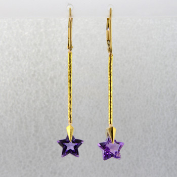 You can wish upon a star with these beautiful star earrings. Exclusively ours, each amethyst gemstone star is custom cut just for us, in Canada, by master gem cutters who know what stars look like. Each star measures 8mm, and dangles from the bottom of 14 karat yellow gold teardrop Piercette,and dangling from a thin gold snake chain wire. These gorgeous earrings measure 1 3/4 inch long, and have lever backs. They are available with Colorless Topaz,and Citrine.  Other colors could take up to 8 weeks delivery, but ask anyway!

Designed and handmade by the artist Stuart J.

A Piercette® is a patented method of setting, with a gemstone that moves. The gem is set so that it swivels with every movement of the wearer, exhibiting extra sparkle.