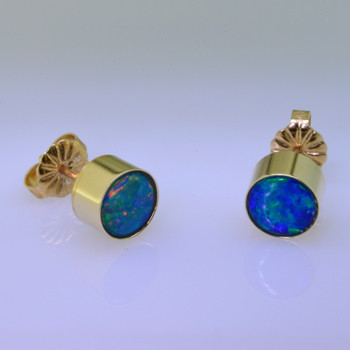 From Andamooka Australia, these dreamy opals will excite you every time you wear them.  For day or night, the color is mesmerizing. 14 karat yellow gold bezel set stud earrings, smooth and comfortable with no prongs to worry about. These opals are 6mm,with posts. 
