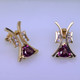 Striking, modern diamond earrings in 14 karat yellow gold with .18ct. T.W. of ideal cut diamonds, and 1.73ct. of rhodolite garnet trillian gemstones with posts.  These elegant diamond earrings measure 3/4". 

Designed, and created in our studio by the artist Stuart J.