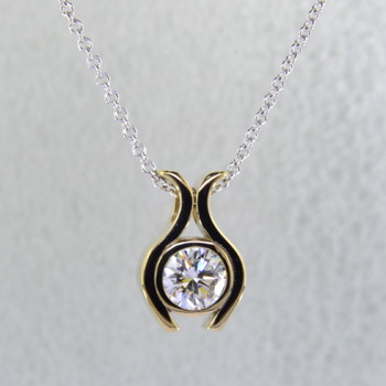 Sweet, simple, modern tulip diamond solitare pendant. Wear it for work or play. Crafted in 14 karat white Gold with .71ct. diamond center, hanging on a 14 karat white gold cable chain in 18". Measure 1/2 inch long.

Designed, and created in our studio by the artist Stuart J.