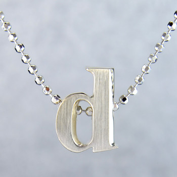What's your story? Begin with this Little "d" initial, solid Sterling Silver pendant. Wear it alone, with other pendants, or layered with other necklaces. Comes with a sterling silver ball chain, 16 inches long. The pendant measures 1/4 inch long. Too cute!

Signified by a feminine sensibility and optimistic charm, Alex Woo's Little Icon Collections reinvent familiar symbols from the world around us into fresh and expressive designs.

Designed and handcrafted by Alex Woo in New York City.